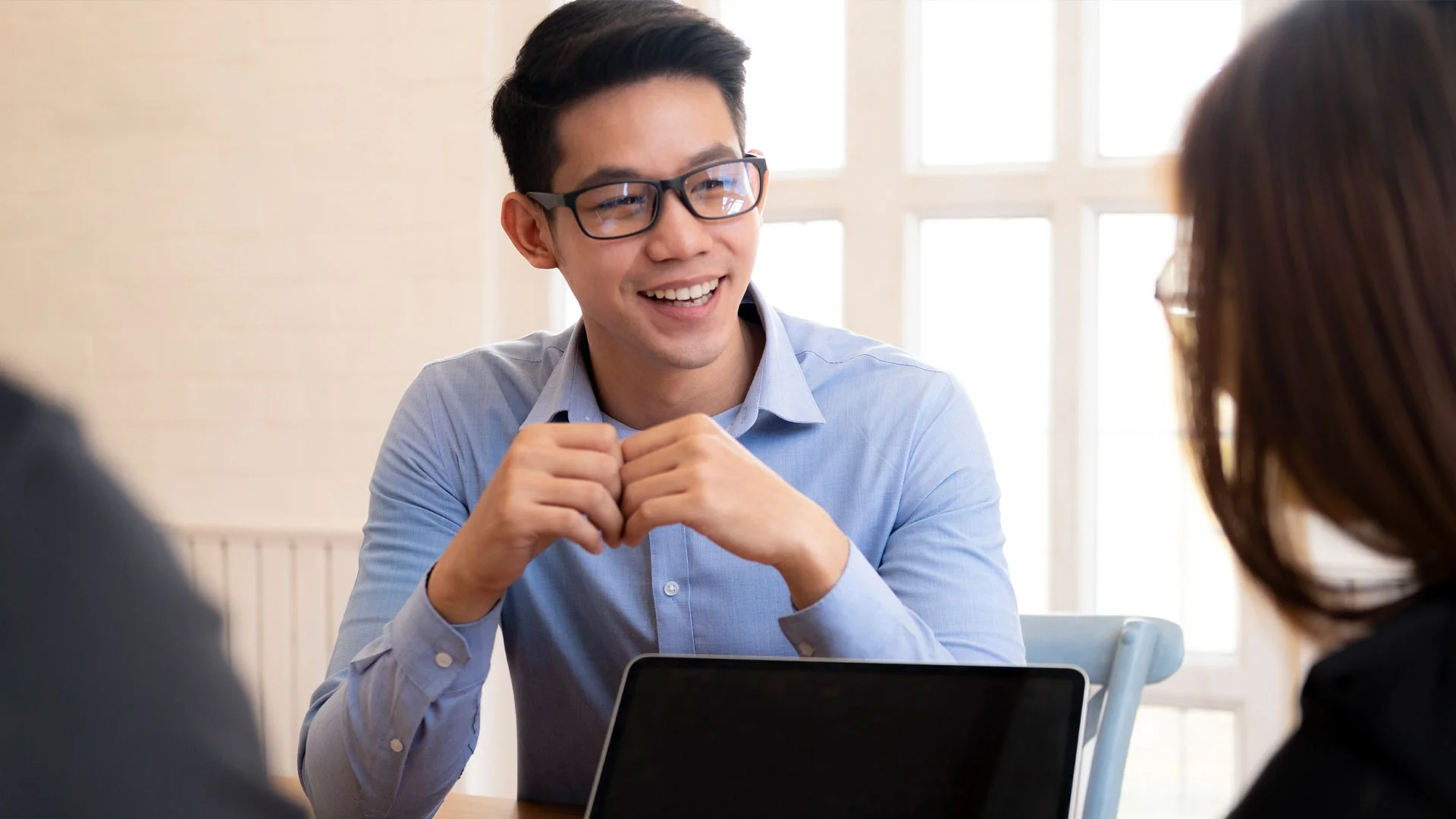 Young man answering questions in a job interview.