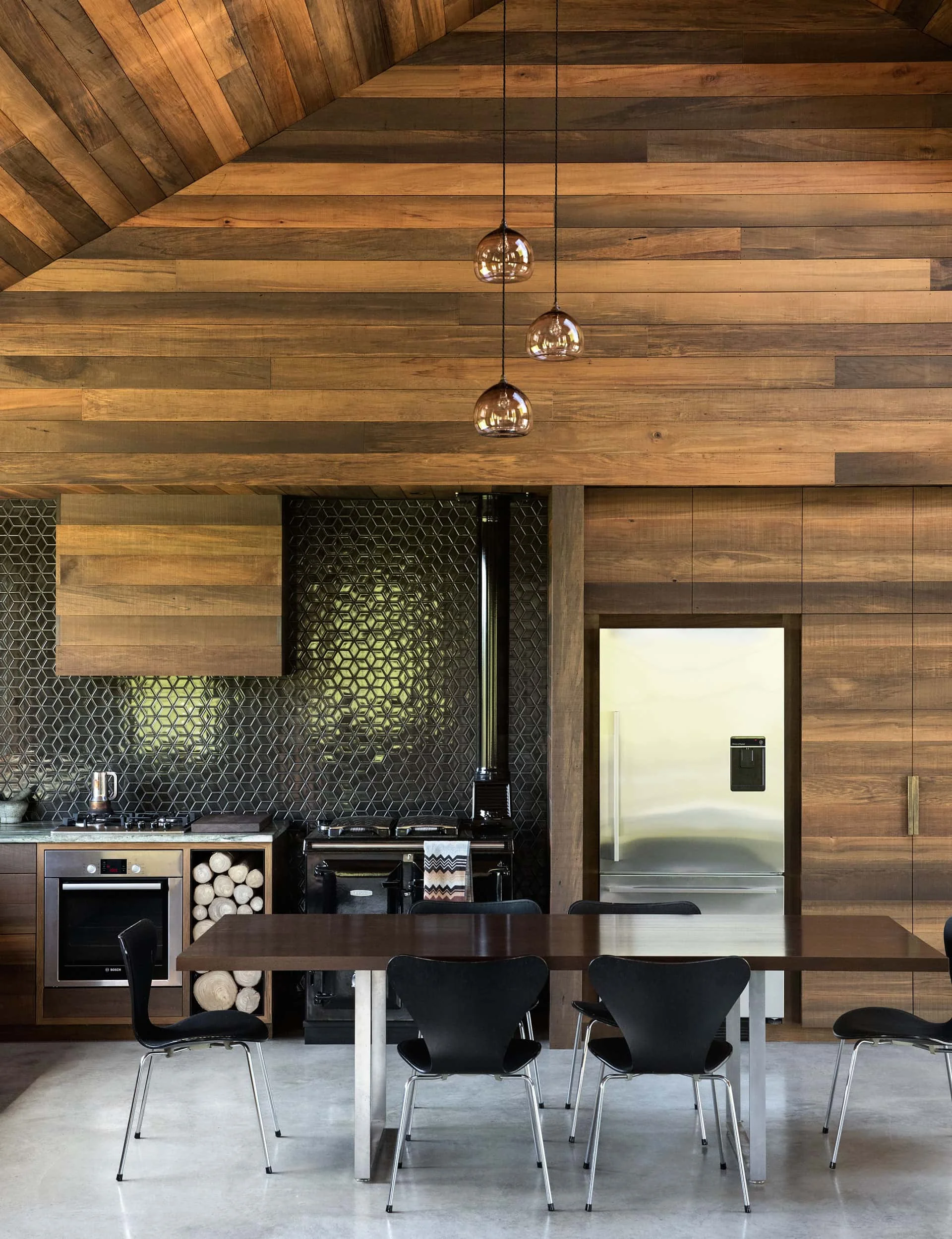 Eco-friendly kitchen with sustainable wooden cabinetry, reclaimed countertops, and energy-efficient lighting fixtures.