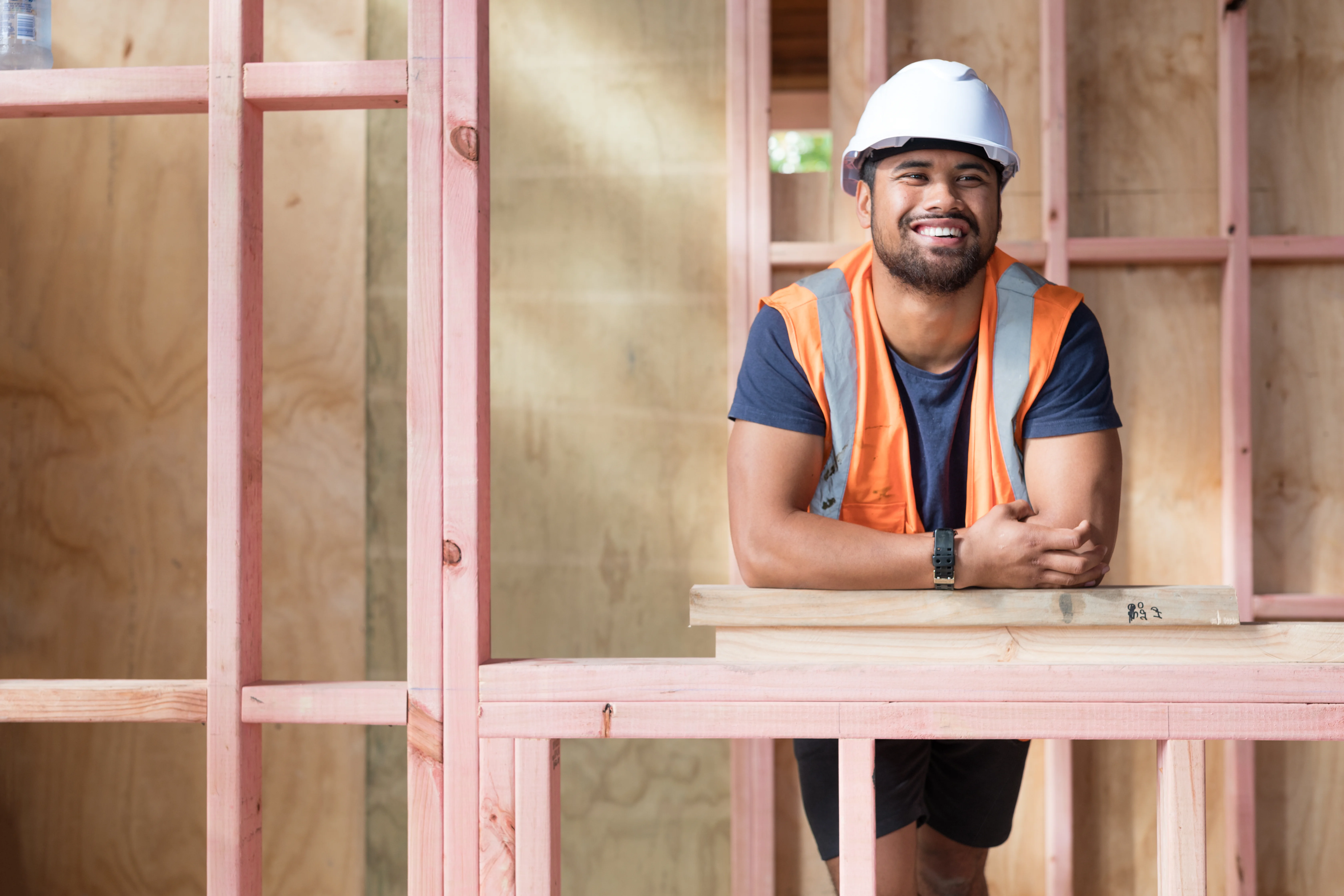 Young Māori man working on a building site in New Zealand.