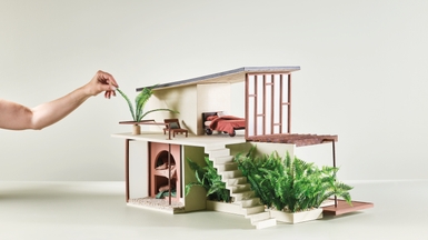 MAIN IMAGE: Backdrop in Resene SpaceCote Low Sheen in Resene Hindsight; roof in Resene Summit Roof in Resene Ironstone; exterior in Resene Lumbersider in Resene Creme De La Creme, Resene FX Paint Effects Medium mixed with Resene Lumbersider in Resene Tua Tua and Resene FX Paint Effects Medium mixed with Resene Lumbersider in Resene Awaroa Bay, resene.co.nz/colorshops.