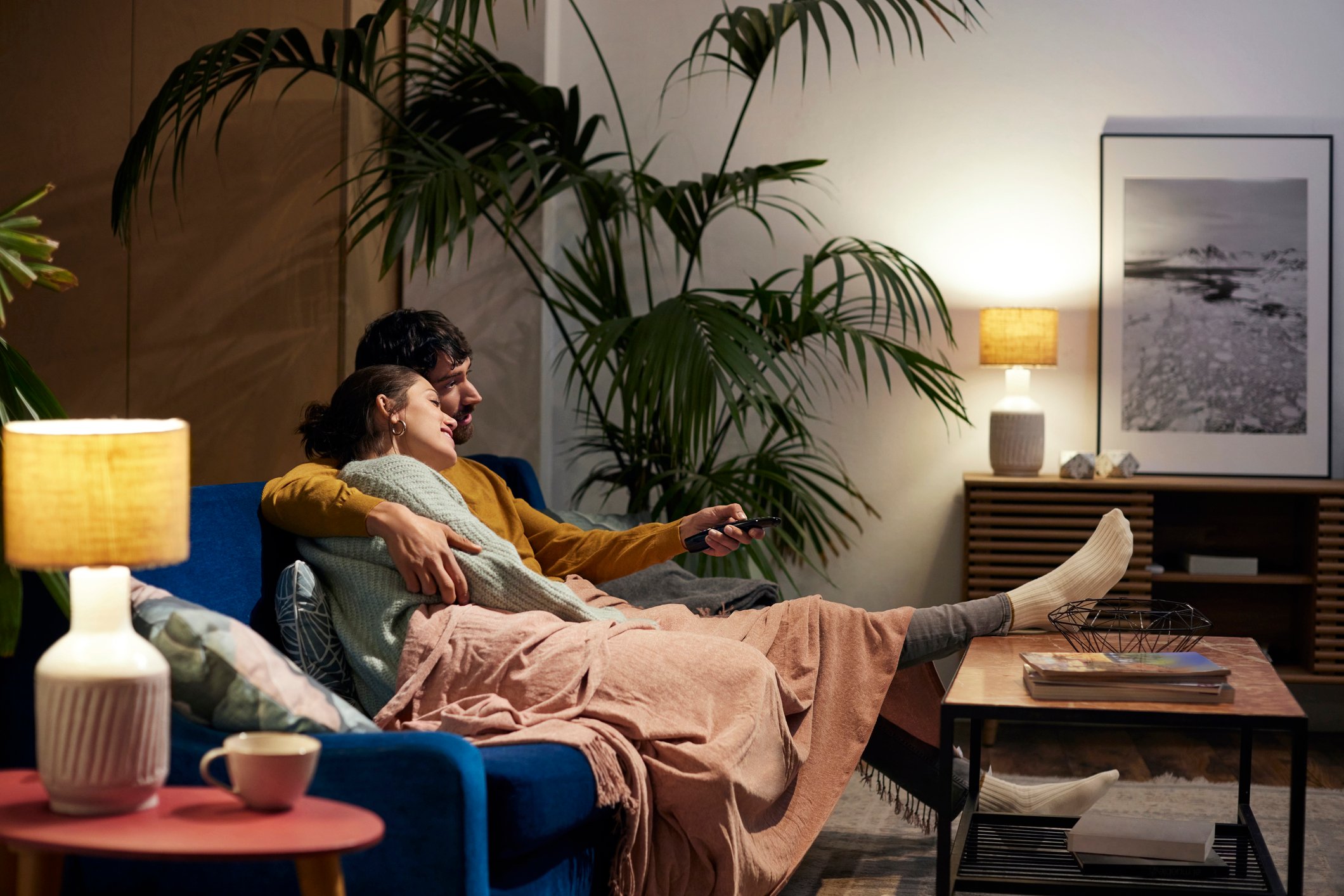 Couple on the couch in a cosy home setting