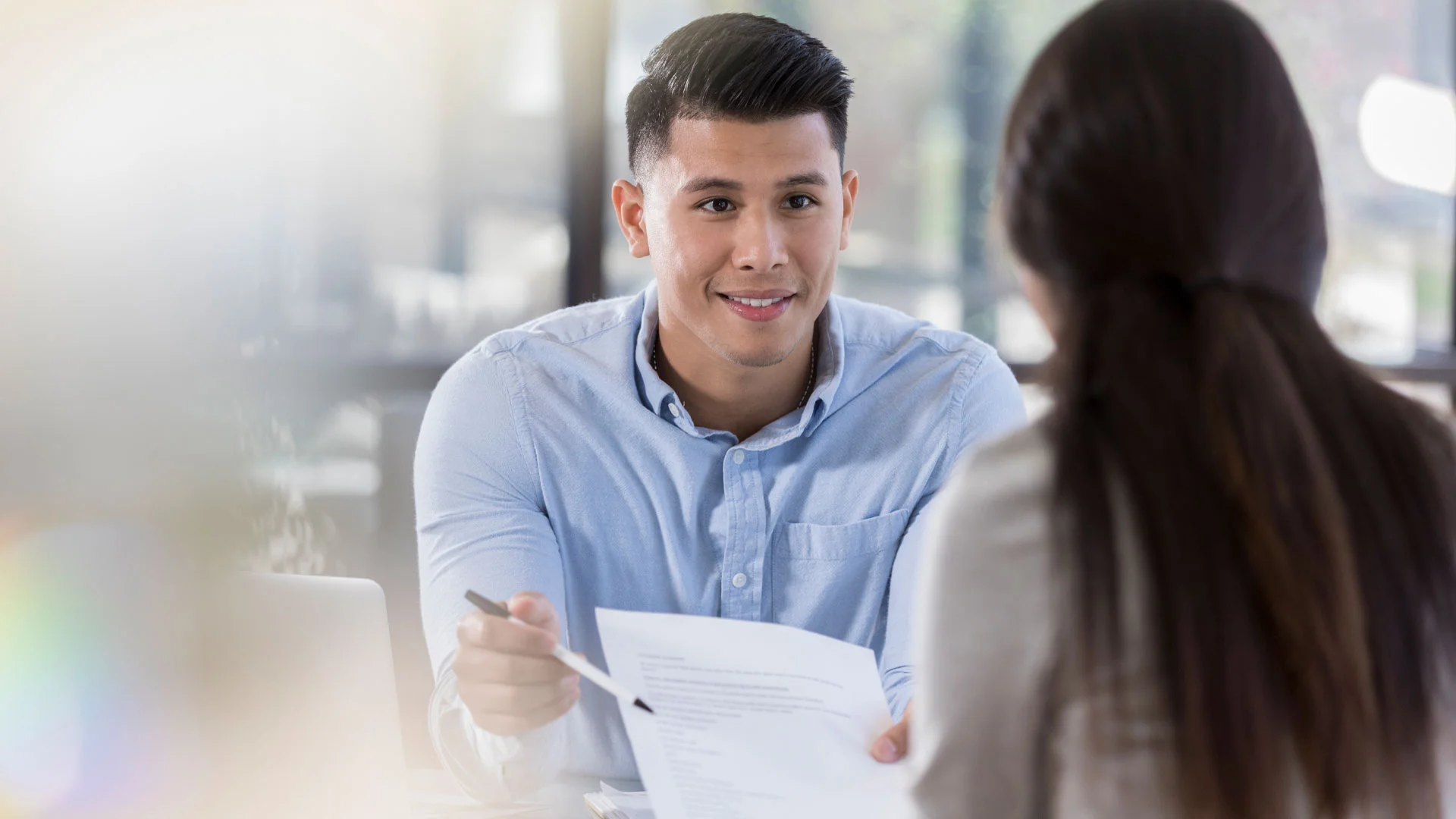 Graduate working in a management consulting job in New Zealand.