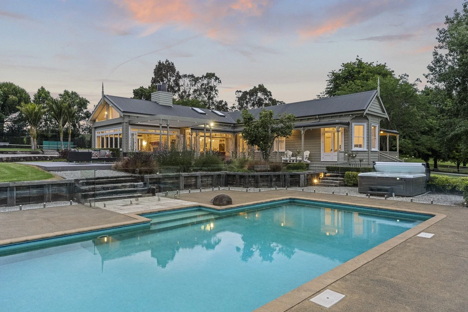 Spacious luxury home with a sparkling swimming pool, expansive outdoor entertaining area, and elegant modern design throughout. 